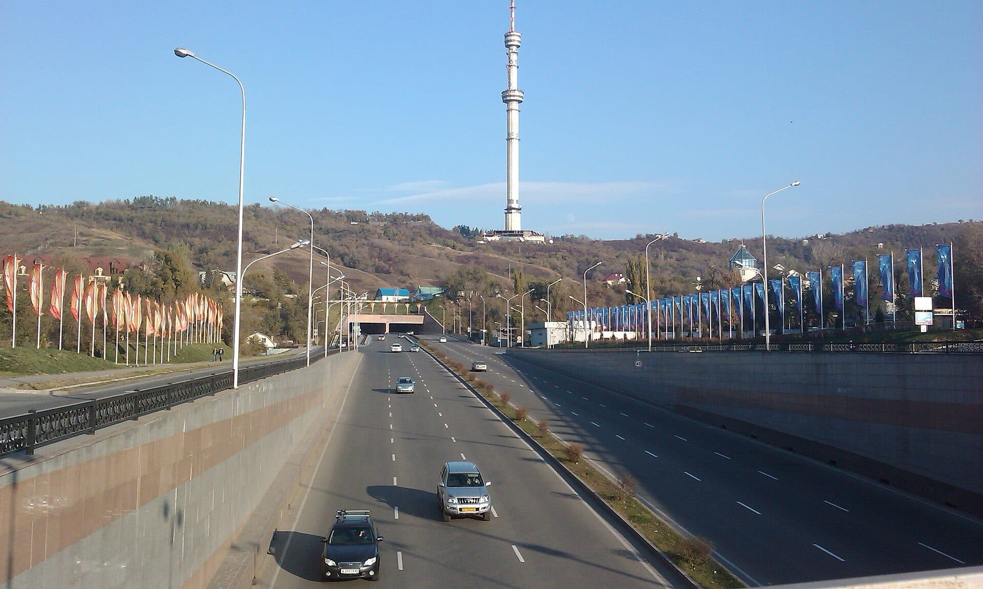 Al-Farabi Avenue at the Dostyk interchange with the Kok-Tobe TV tower — what a minibus trip costs