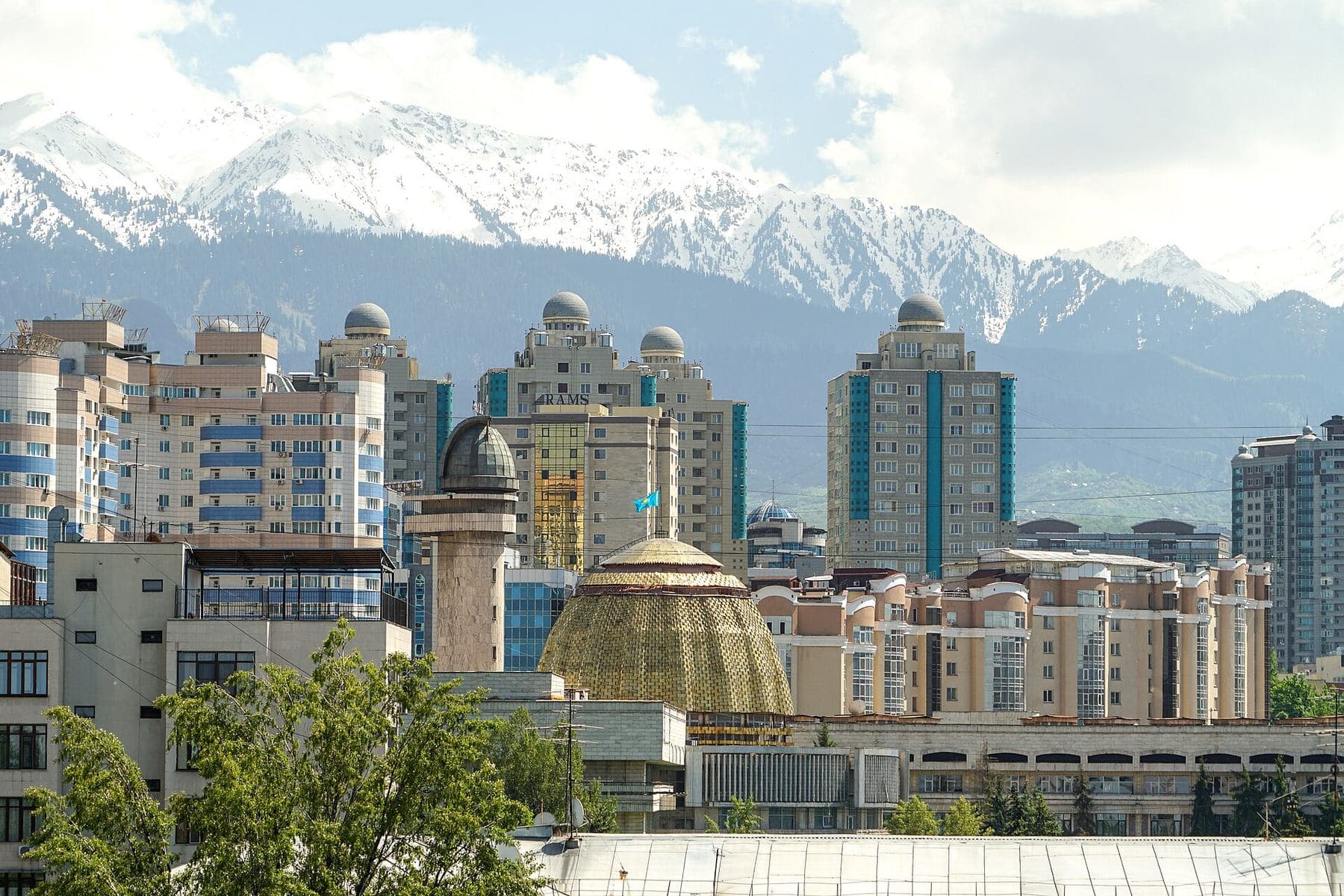 Almaty with the snowy Trans-Ili Alatau right behind the city — where to go from Almaty in any season